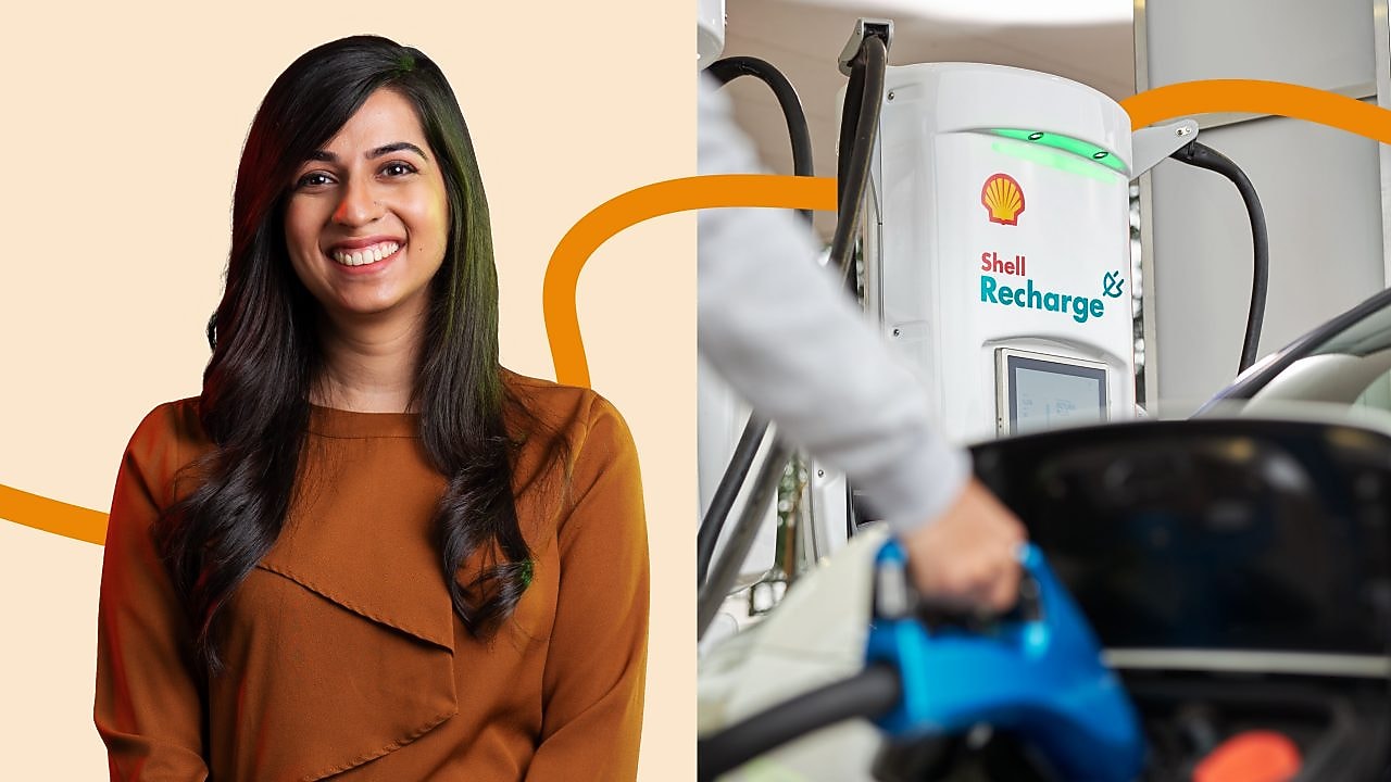 Young female Shell employees smiling at a meeting
