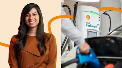 Young female Shell employees smiling at a meeting