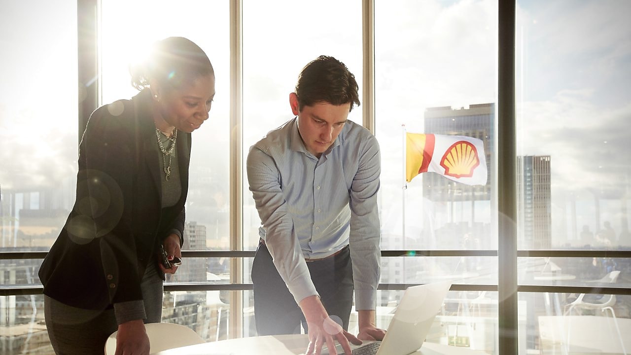 Shell intern discussing plans with his manager