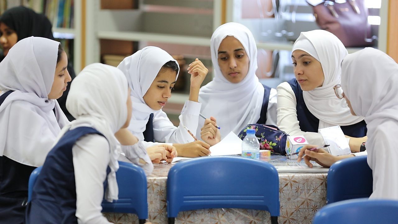 Girls sitting in group