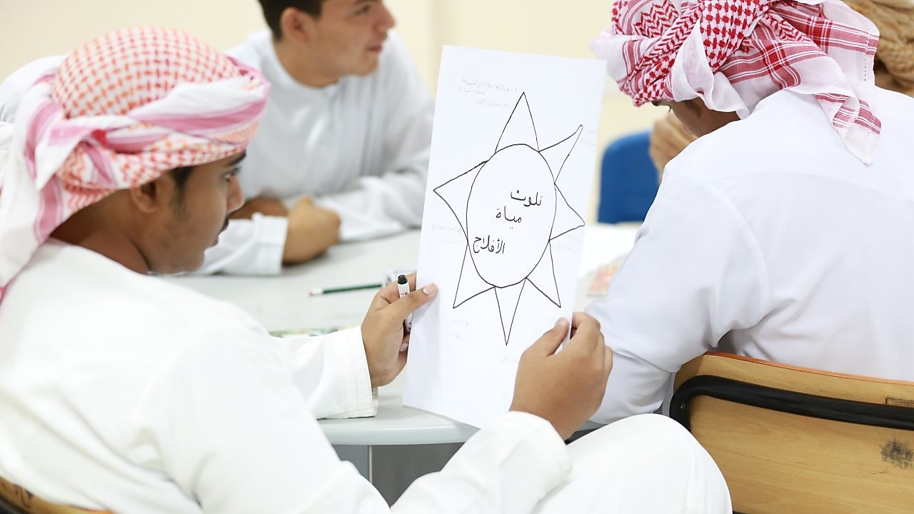 man looking at paper